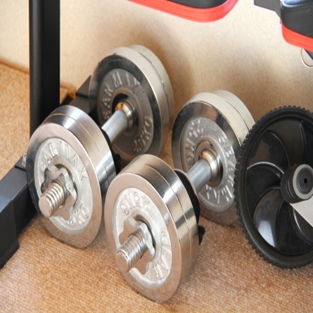 Collection of unwanted exercise equipment such as dumbbells.